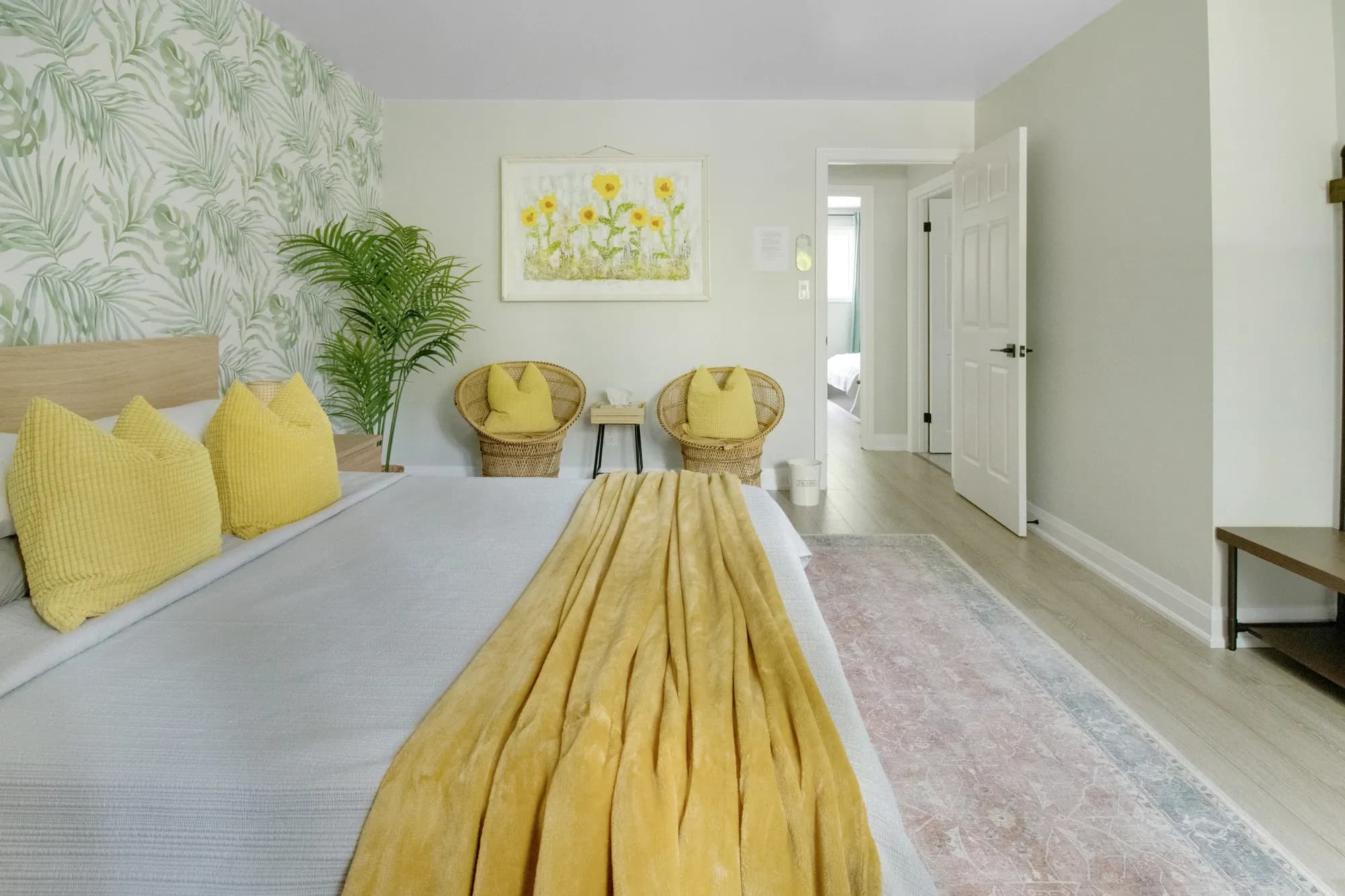 A second bedroom with two reading chairs by the window